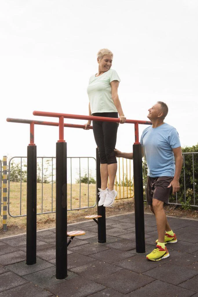 senior couple working out together park